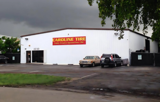 Tire shop building with parked cars